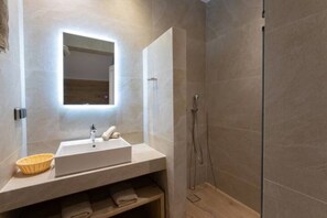 Shower, hair dryer, towels, shampoo