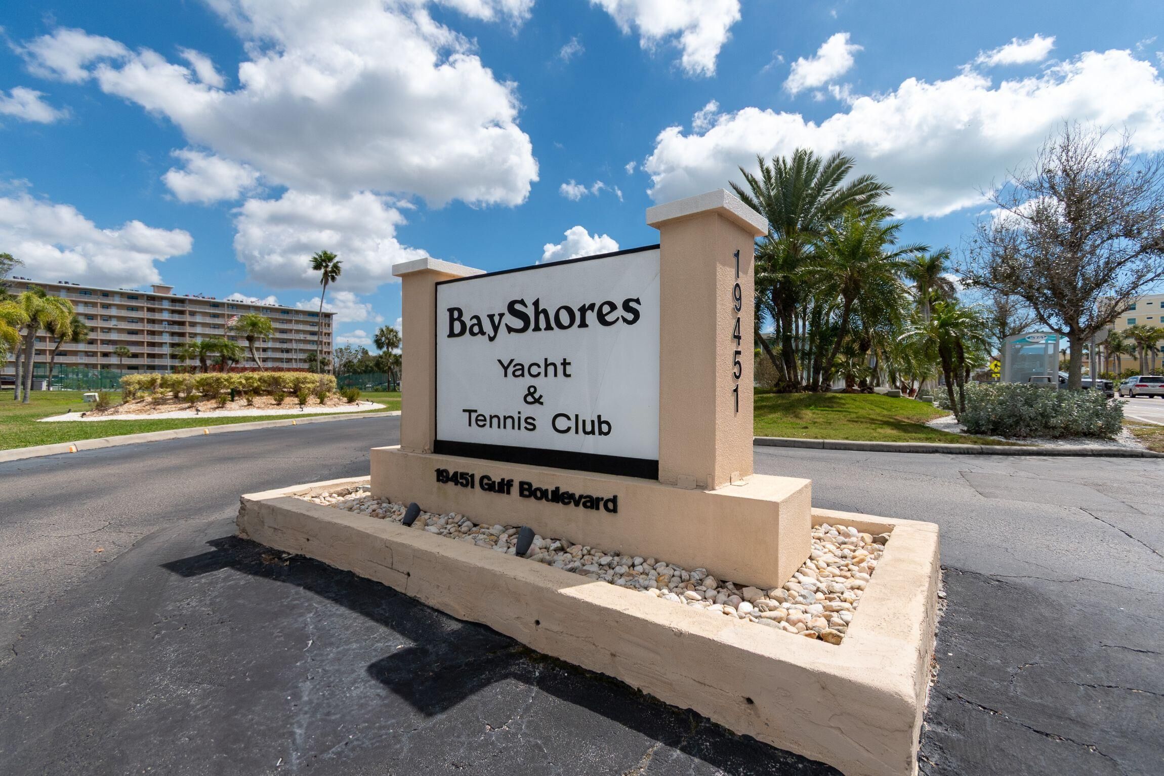 A sign for BayShores Yacht & Tennis Club located at 19451 Gulf Boulevard.