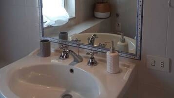 Hair dryer, bidet, towels, soap