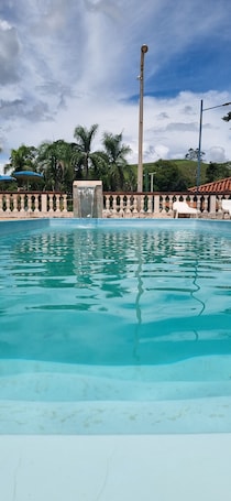 Outdoor pool. Pousada Temática Estrada Real