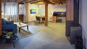 Comfort Apartment, Accessible, Courtyard View | Living area | 42-inch Smart TV with digital channels, fireplace