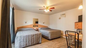 Desk, laptop workspace, free WiFi, bed sheets