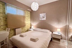 1 bedroom, desk, bed sheets