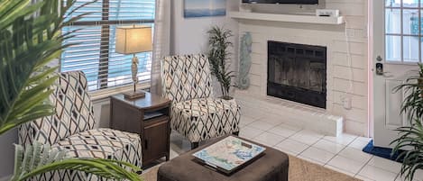 TV, fireplace, books