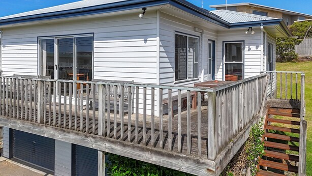 A single-story house with a covered porch and a small deck. - The Lost Lobster - Beach Shack (Port Fairy)