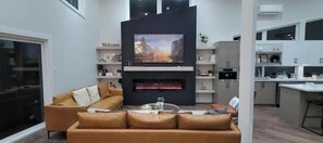 Smart TV, fireplace, table football, books