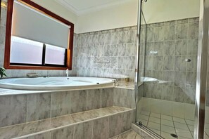Shower, towels, soap, toilet paper