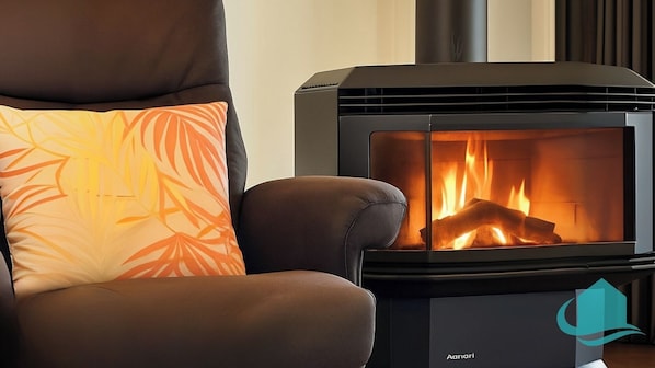 A modern living room with a sofa and a wood-burning stove. - Village Bay Lake house, family Lake House with Spa (Marks Point)