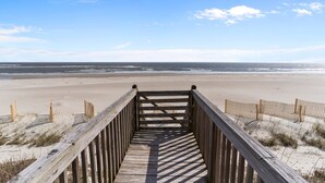 A wooden boardwalk leading to a beach with sand dunes and the ocean in the background. - "Narwhal Nest" Newly remodeled, 5 bed/3 bath, oceanfront home! (Supply)