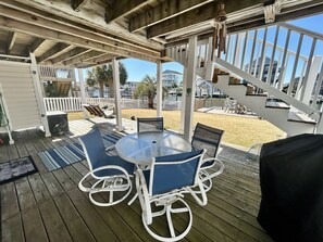 Outdoor dining - Canal by the Sea: Renovated canal home with decks, boat access and fenced pet-friendly yard (Supply)