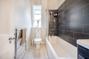 Hair dryer, towels, shampoo, toilet paper