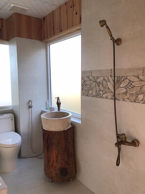 Designer toiletries, hair dryer, slippers, towels