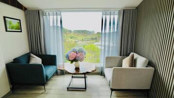 VILLA DELUXE | Living area | 24-inch TV with premium channels