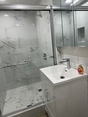 Shower, hair dryer, towels, soap
