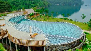 Outdoor pool, open 7:00 AM to 9:00 PM, pool umbrellas, pool loungers