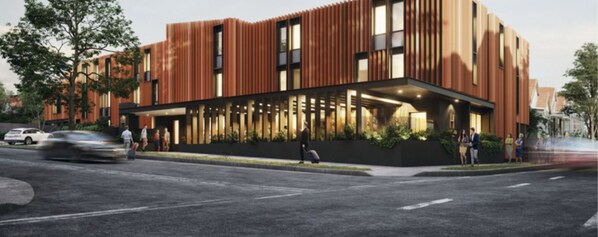 Un bâtiment moderne doté d ’une façade en bois et de grandes fenêtres.