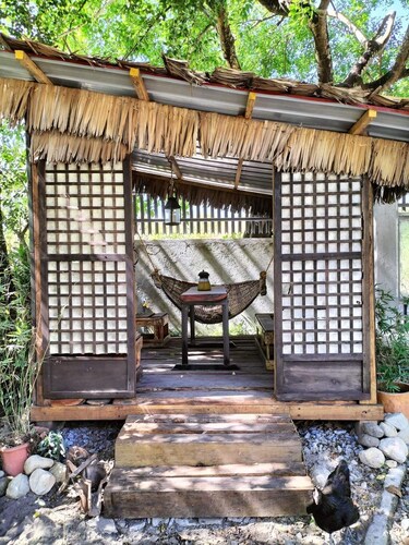 Private traditional kubo with mountain views on a peaceful Zambales farm