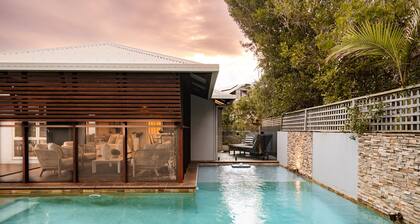 Experience the epitome of luxury beachside living in this stunning home.