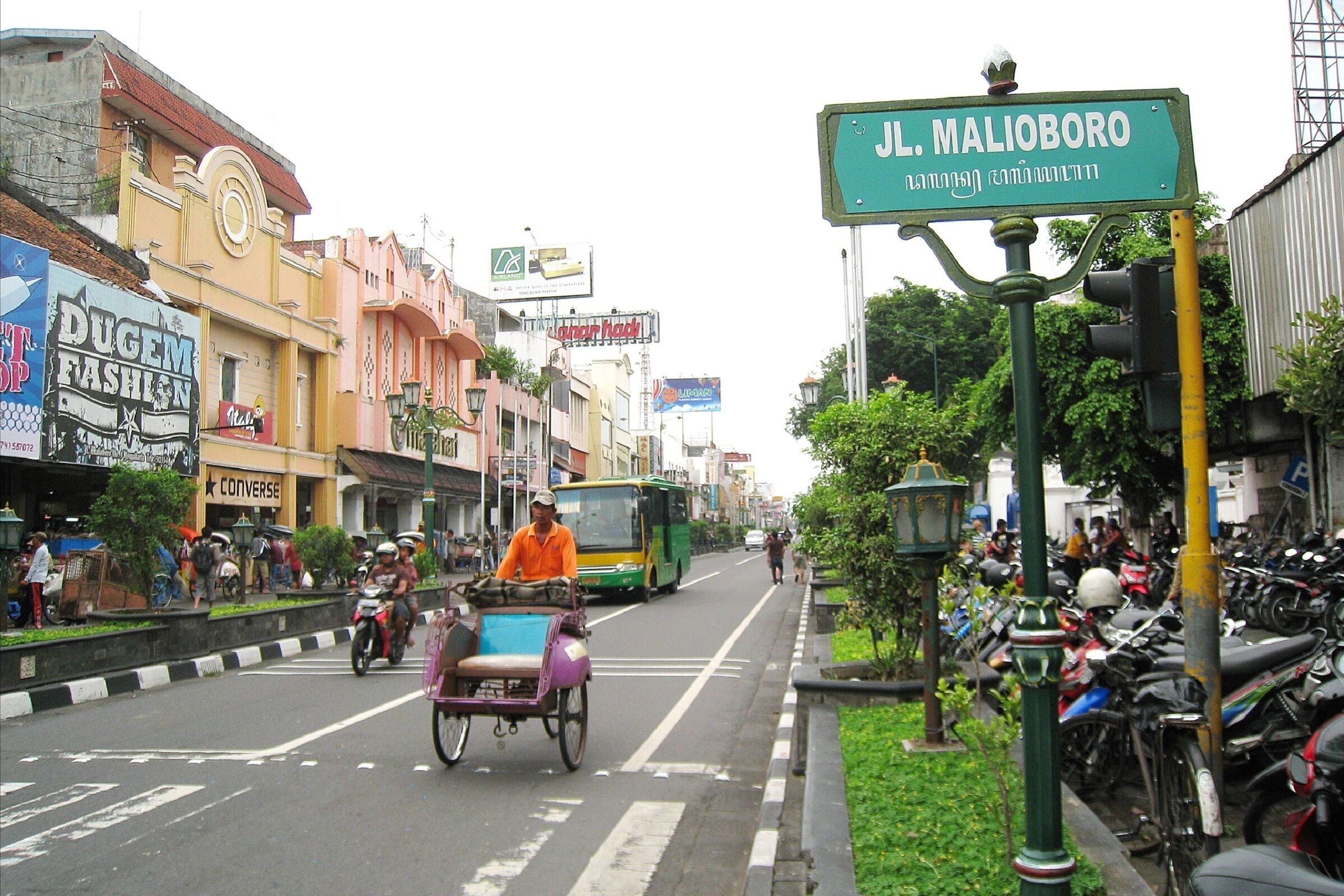 A street scene with a sign reading "J.L. MALIBORO".