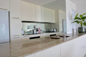 Fridge, microwave, oven, stovetop - Beachfront 3-Bed with Pool & Stunning Ocean Views (Trinity Beach)