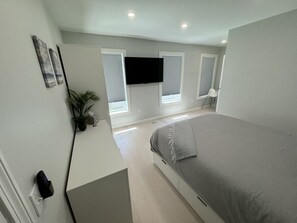 1 bedroom, desk, iron/ironing board, travel crib