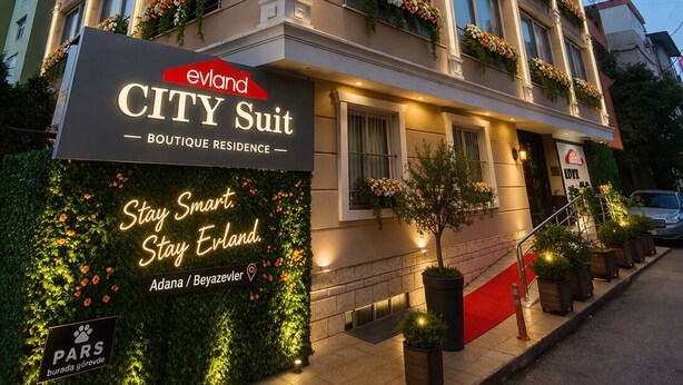 A multi-story building with a sign for 'evland CITY Suit Boutique Residence'. - EVLAND CİTY SUİT (Adana)