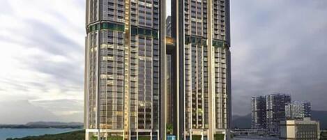 A high-rise building with multiple floors, large windows, and a modern architectural design.