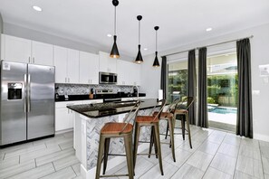 Fridge, oven, stovetop, dishwasher - Elegant Home near Disney with Game & Themed Rooms with Waterpark & Resort. (Kissimmee)