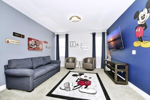 TV - Stylish Home with Private Pool, Themed and Game Room with Waterpark & Resort Access near Disney at. (Kissimmee)