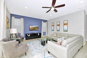 TV - Stylish Home with Private Pool, Themed and Game Room with Waterpark & Resort Access near Disney at. (Kissimmee)