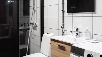 Standard Apartment | Bathroom | Hair dryer, toilet paper