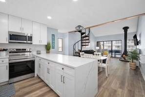 Oven, stovetop, dining tables