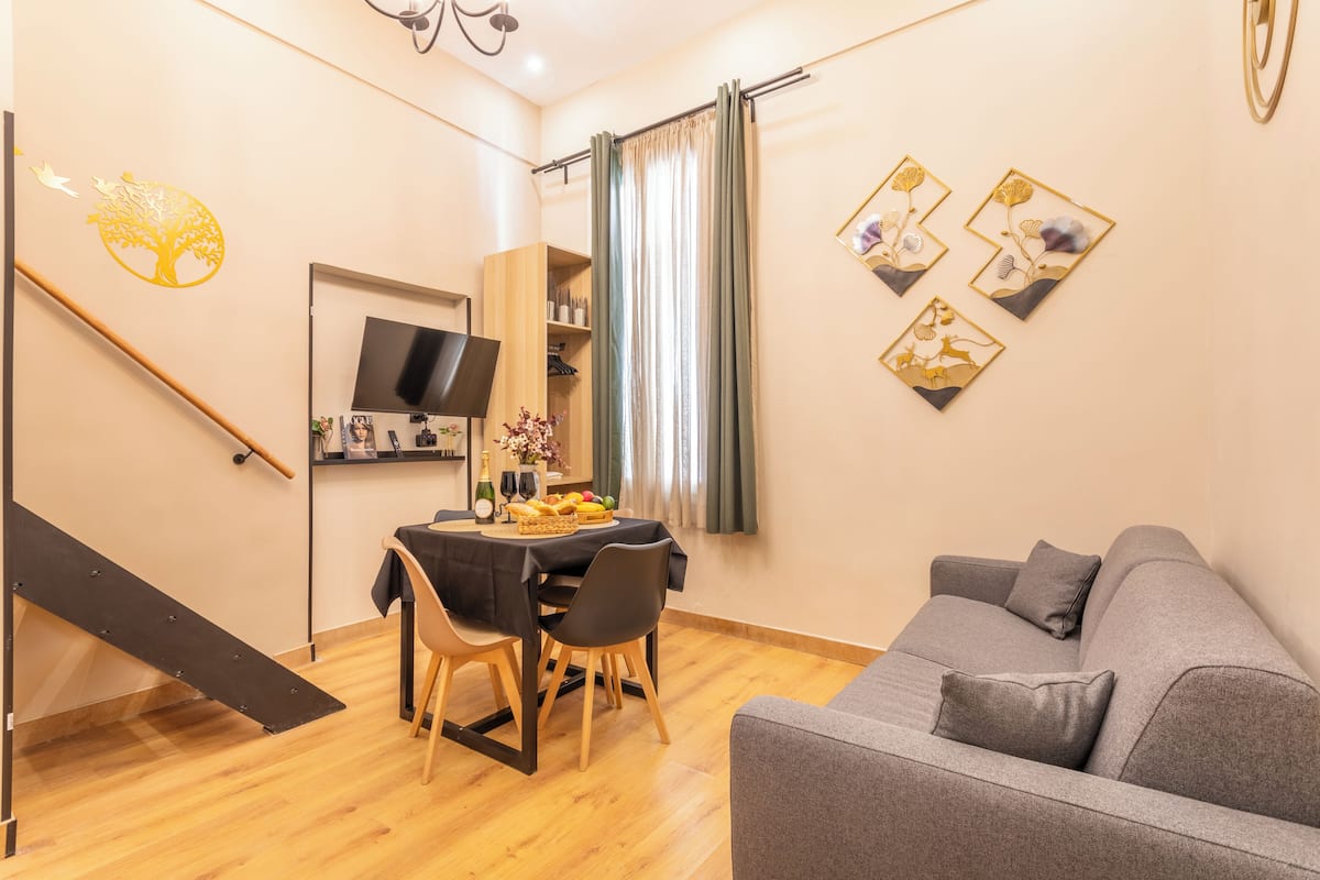 City Apartment (2- CORNICHE) | Living area | 164-cm Smart TV with digital channels