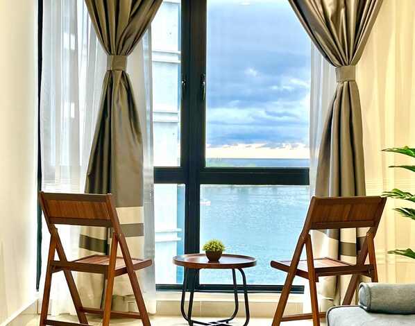 Deluxe Condo, Sea View | 1 bedroom, desk, laptop workspace, iron/ironing board - Covesign Suite, The Shore Kota Kinabalu (Kota Kinabalu)