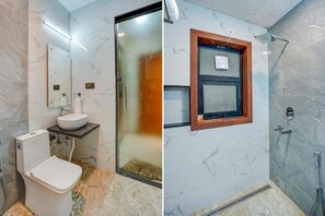 A bathroom with a toilet, sink, and shower area. - The Grand Mansion Hotel (Greater Noida)