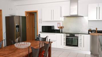 Villa | Private kitchen | Fridge, microwave, oven, stovetop