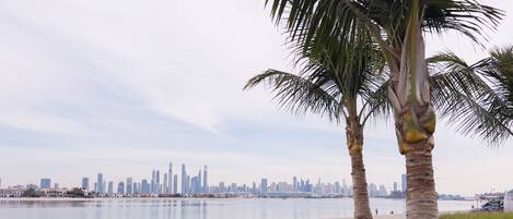 On the beach, white sand, beach umbrellas, beach towels