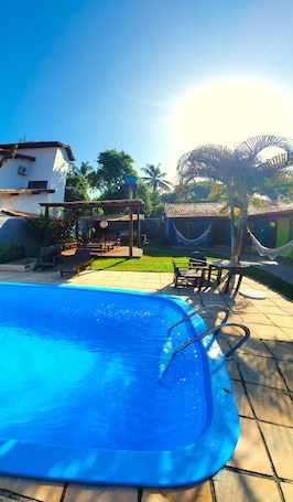Outdoor pool, pool umbrellas, sun loungers