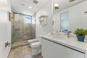Shower, hair dryer, towels, soap