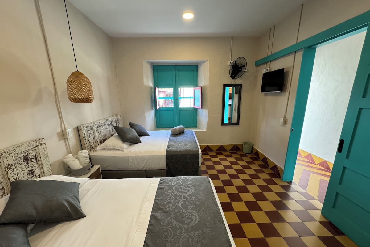 Comfort Quadruple Room | Premium bedding, free WiFi, bed sheets