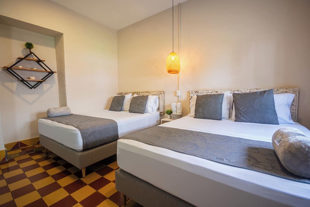 Comfort Quadruple Room | Premium bedding, free WiFi, bed sheets