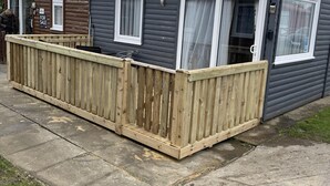 A two-story house with a wooden deck, a satellite dish, and a 'For Sale' sign. - 2 Bed Chalet Sleeps 4- Garden, Pets, Beach (Bridlington)