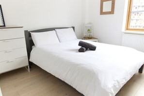 Departamento | 1 habitación, tabla de planchar con plancha, wifi gratis y ropa de cama