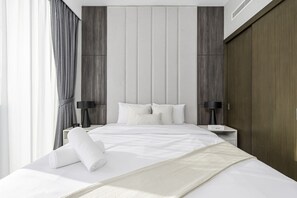 2 chambres, coffres-forts dans les chambres, fer et planche à repasser
