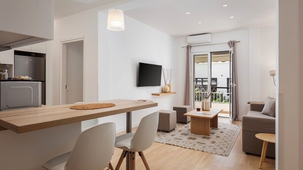 A modern living space with a kitchen, dining area, and seating area. - Athenian Hillside Residence (Athens)