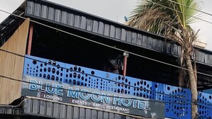 A two-story building with a sign for "Blue Moon Hotel" indicating it offers lodging, events, bar, and restaurant services. - Blue Moon Hotel Victoria Island (Lagos)