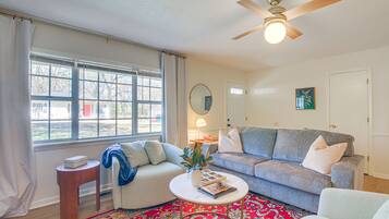 Relax in this inviting living space with a sofa, coffee table, and comfortable rug.