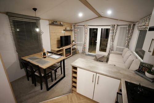 Inviting 3-bed Lodge in Preston hot tub