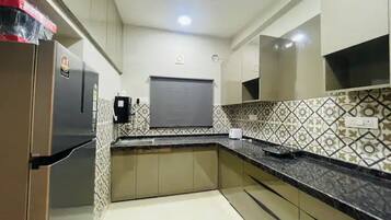 Fridge, microwave, cookware/dishes/utensils