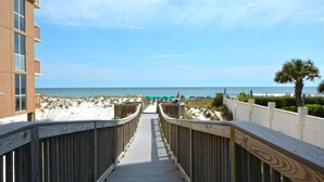 A wooden boardwalk leading to a beach with a clear view of the ocean. - Terrace @ Pelican Beach Resort 307b * Hotel accommodation * Salt Water Vacations (Destin)